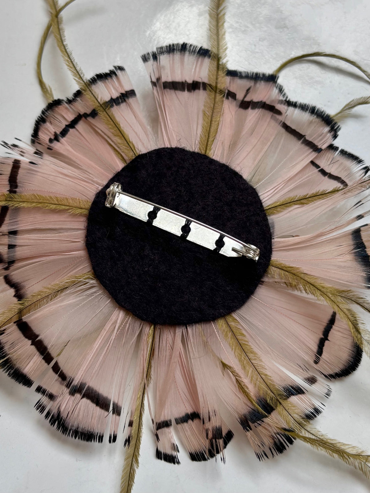 Pink and green feathers brooch