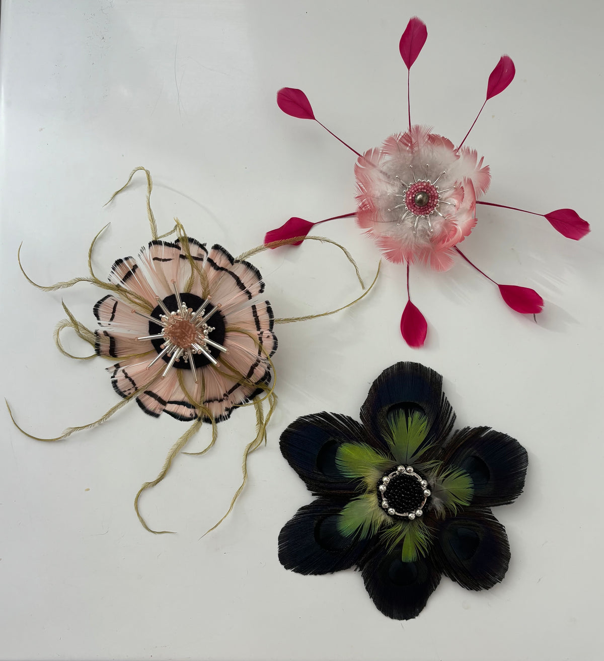 Pink and green feathers brooch